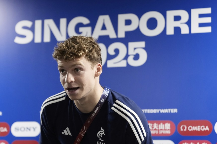 Leon Marchand from France arrives for the press conference at the World Aquatics Championships in Singapore, Saturday, July 26, 2025. (AP Photo/Lee Jin-man)
Singapore Swimming Worlds Marchand Returns