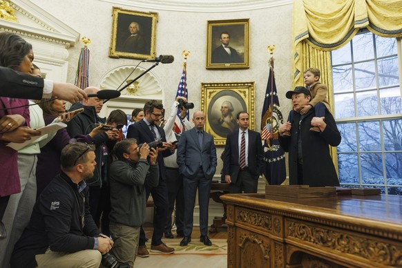epa11889346 US entrepreneur and U.S. special government employee Elon Musk (R), with his son X, gives remarks to the media in the Oval Office of the White House, as he meets with US President Donald J ...