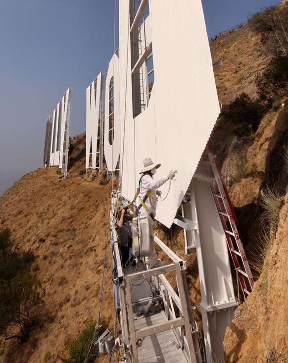 HOLLYWOOD, CALIFORNIA - OCTOBER 13: The Hollywood Sign gets repainted ahead of its 100th Anniversary on October 13, 2022 in Hollywood, California. (Photo by David Livingston/Getty Images for The Holly ...