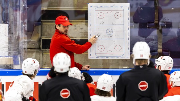 Patrick Fischer, head coach of Switzerland national ice hockey team, talks to his players, during a Switzerland team training session at the IIHF 2025 World Championship, at the Kvik Hockey Arena, in  ...