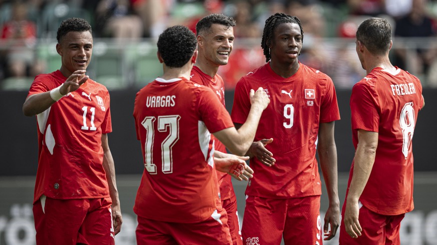 Switzerland's Dan Ndoye, Ruben Vargas, Granit Xhaka, Johan Manzambi and Remo Freuler, from left, celebrate after Xhaka scoring a penalty to 3-0 against Jordan's goalkeeper Yazeed Abulaila, d ...