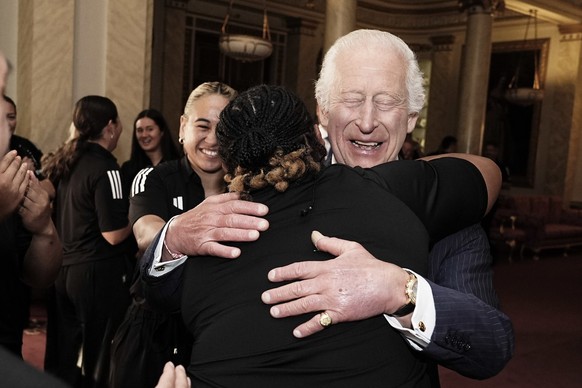 King Charles III smiles as he meets New Zealand&#039;s Black Ferns rugby union team at Buckingham Palace in London, England, Wednesday Sept. 11, 2024. (Aaron Chown/PA via AP)