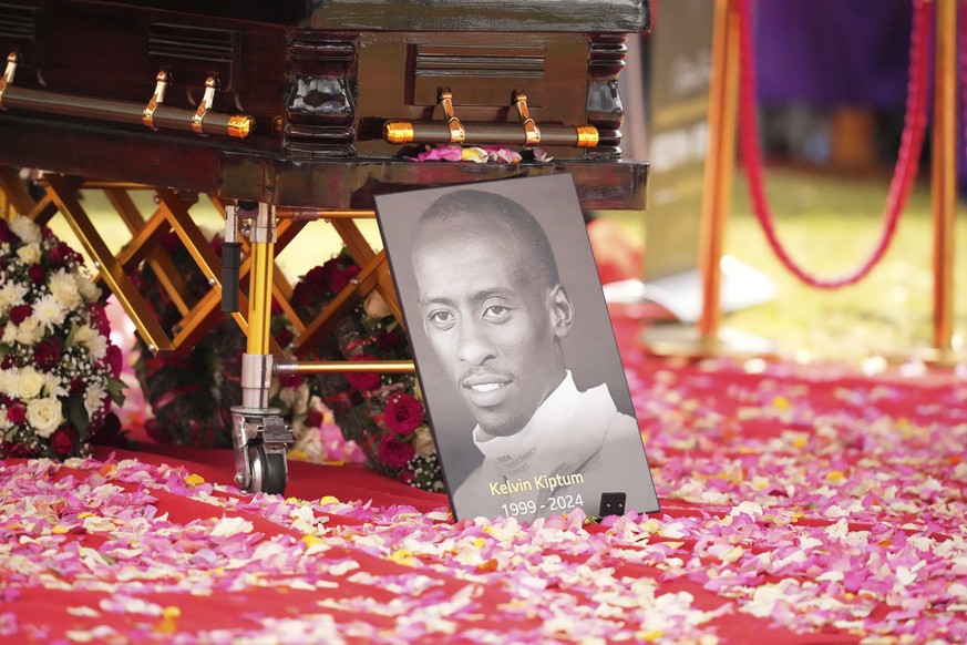 FILE - A portrait of Kelvin Kiptum is placed next to his casket, ahead of his burial, in Elgeyo Marakwet, Kenya, Friday Feb. 23, 2024. (AP Photo/Brian Inganga, File)