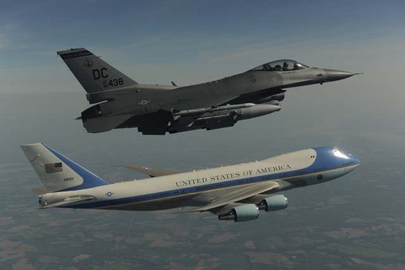 This undated photo released by the Defense Department shows one of the president&#039;s official planes, escorted by a fighter jet, flying over New York. (AP Photo/Master Sgt. Andy Dunaway, Defense De ...