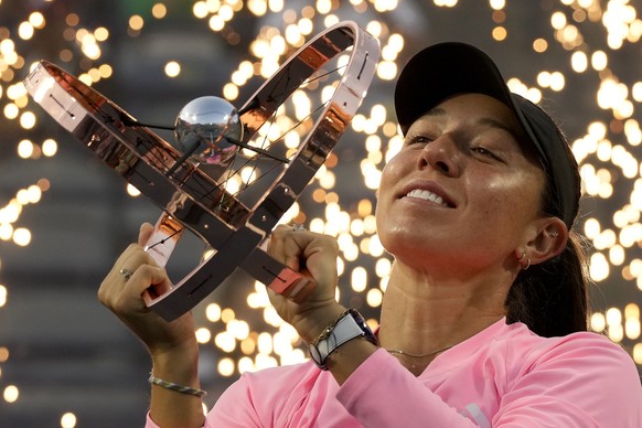 Pyrotechnics fire behind Jessica Pegula, of the United States, as she lifts her trophy following her women&#039;s singles win at the National Bank Open tennis tournament in Toronto, Monday, Aug. 12, 2 ...