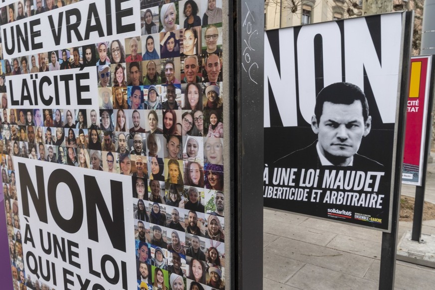 Des affiches sur la votation cantonale et sur la loi sur la laicite de l&#039;Etat avec le portrait de Pierre Maudet sur une affiche, photographie ce dimanche 20 janvier 2019 a Geneve. Les citoyens Ge ...