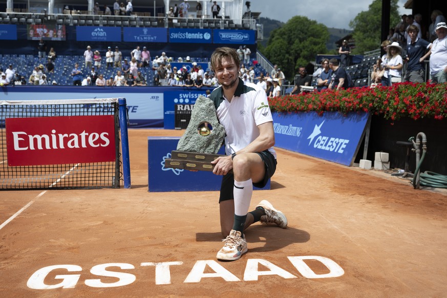 Alexander Bublik of Kazhakztan, winner, celebrates with the trophy after the final game against Manuel Cerundolo of Argentina at the Swiss Open tennis tournament in Gstaad, Switzerland, on Sunday, Jul ...