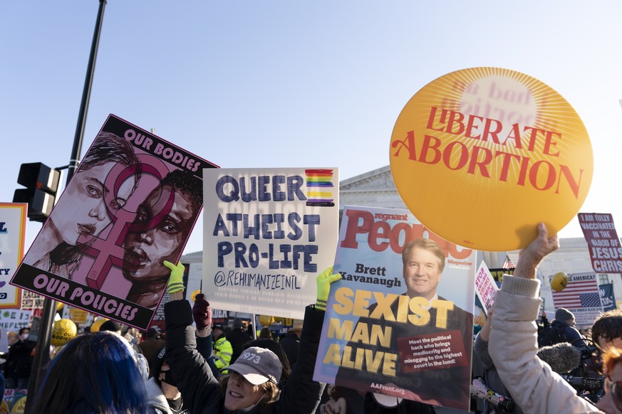 Abortion rights advocates demonstrate in front of the U.S. Supreme Court Wednesday, Dec. 1, 2021, in Washington, as the court hears arguments in a case from Mississippi, where a 2018 law would ban abo ...