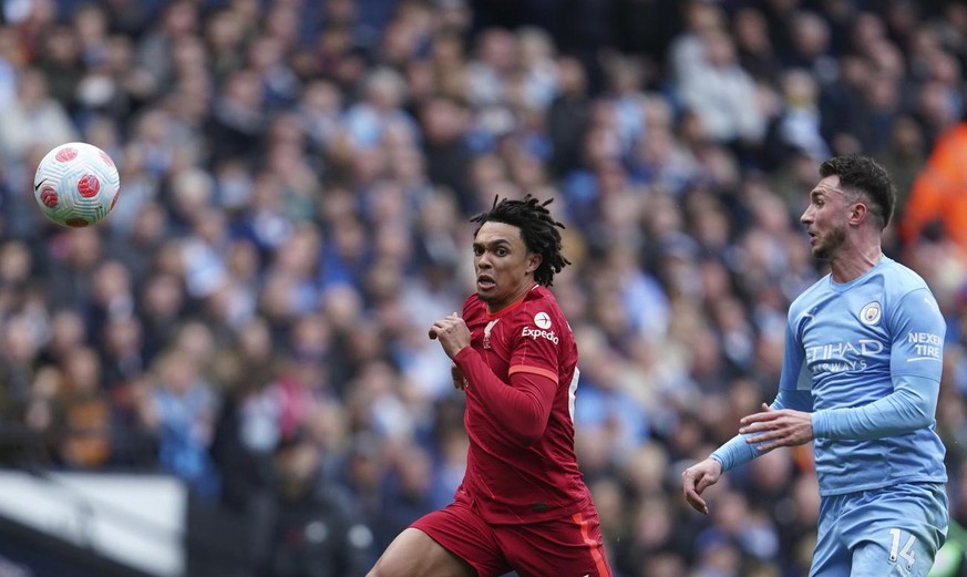 Liverpool&#039;s Trent Alexander-Arnold, left, duels for the ball with Manchester City&#039;s Aymeric Laporte during the English Premier League soccer match between Manchester City and Liverpool, at t ...