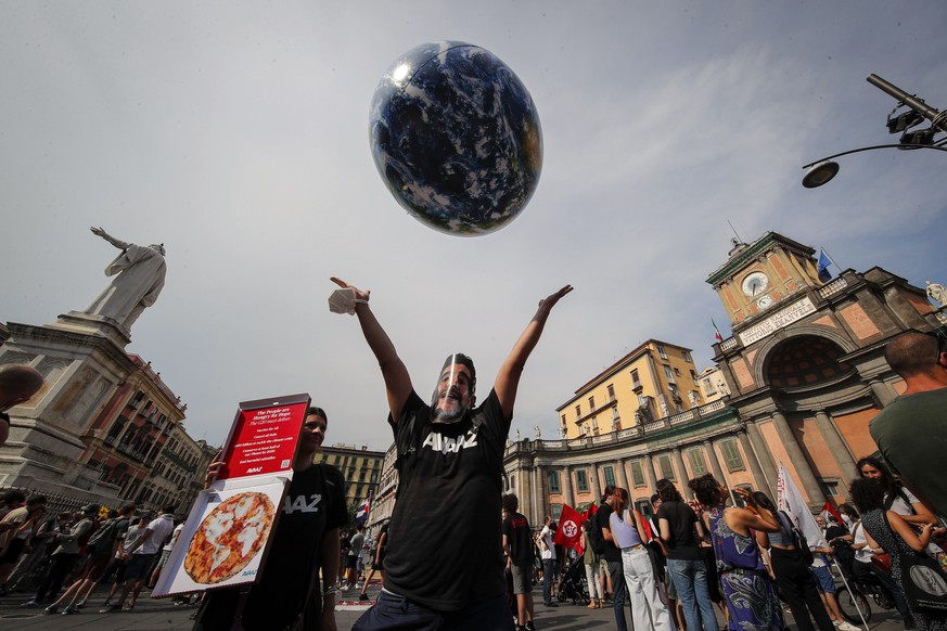 FILE - In this Thursday, July 22, 2021 file photo, people demonstrate on the sidelines of a G20 environment meeting, in Naples, Italy. A coalition of environmental groups called Tuesday, Sept. 7, 2021 ...