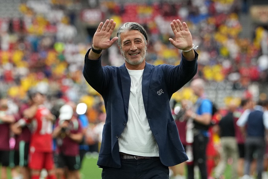 epa13096787 Switzerland's head coach Murat Yakin celebrates with their supporters after winning of the FIFA World Cup 2026 Round of 16 match Switzerland against Colombia, in Vancouver, Canada, 07 ...
