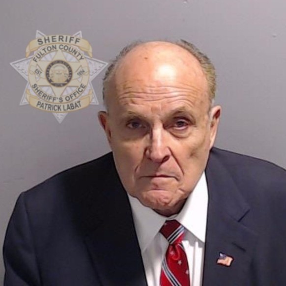 ATLANTA, GEORGIA - AUGUST 23: In this handout provided by the Fulton County Sheriff&#039;s Office, Rudy Giuliani, former personal lawyer for former President Donald Trump poses for his booking photo o ...