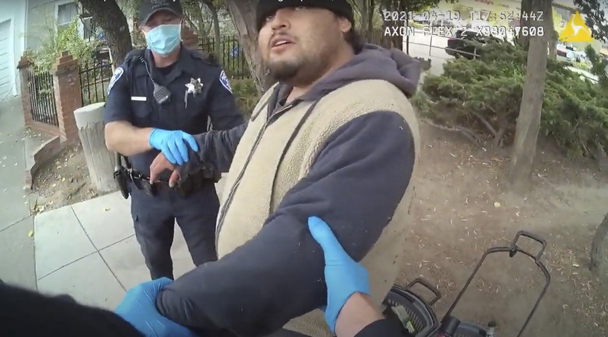 In this image taken from Alameda Police Department body camera video, Alameda Police Department officers attempt to take 26-year-old Mario Gonzalez into custody, April 19, 2021, in Alameda, Calif. The ...