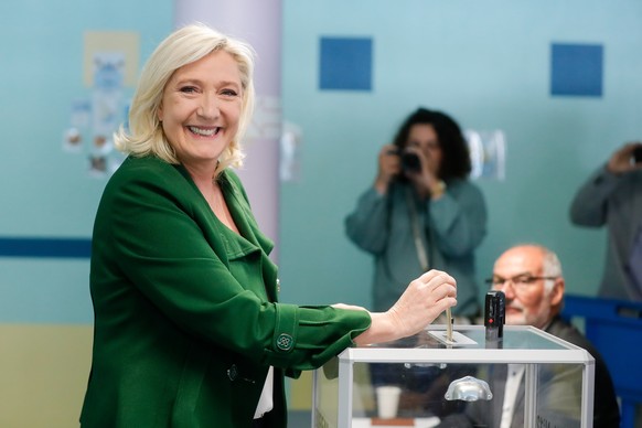 epa10009196 French far right candidate Marine Le Pen of the RN, Rassemblement National party (National Rally in French) casts her ballot in the first round of the legislative elections at a polling st ...