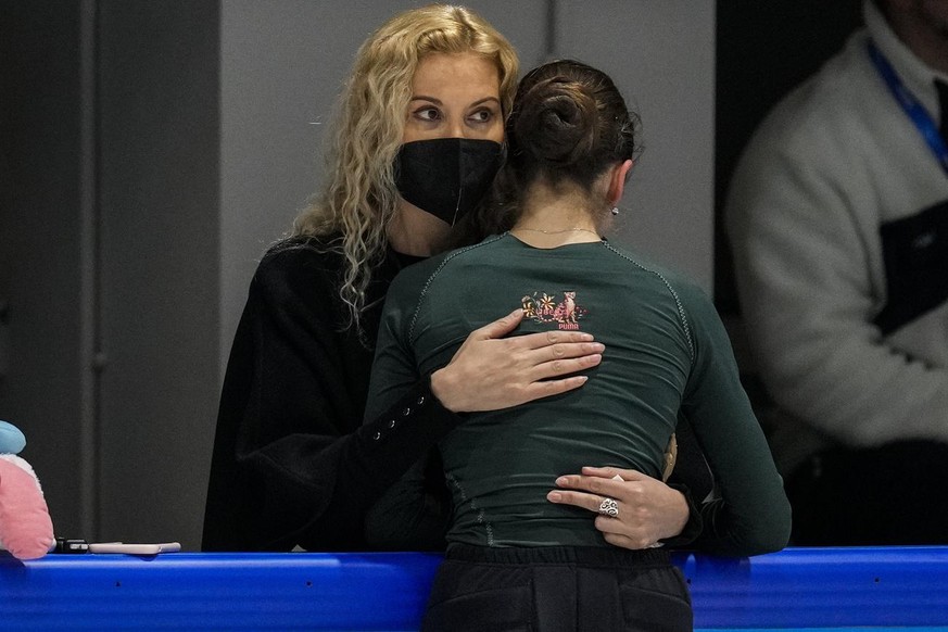 Coach Eteri Tutberidze, left, embraces Kamila Valieva, of the Russian Olympic Committee, during a training session at the 2022 Winter Olympics, Saturday, Feb. 12, 2022, in Beijing. (AP Photo/Bernat Ar ...