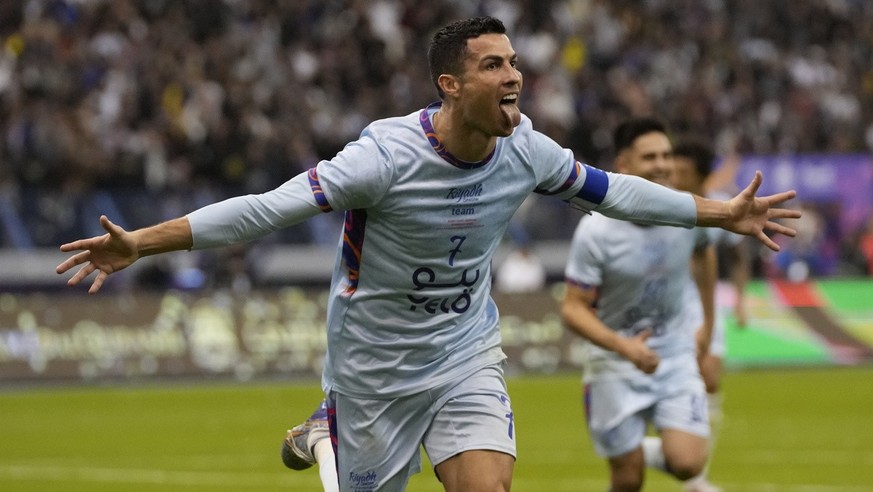 Cristiano Ronaldo celebrates after scoring his side&#039;s second goal playing for a combined XI of Saudi Arabian teams Al Nassr and PSG during a friendly soccer match, at the King Saud University Sta ...