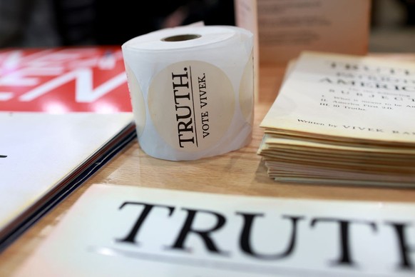 GRUNDY CENTER, IOWA - JANUARY 11: Campaign paraphernalia sits on a table as Republican presidential candidate businessman Vivek Ramaswamy holds a campaign stop at Chad&#039;s Pizza and Restaurant on J ...