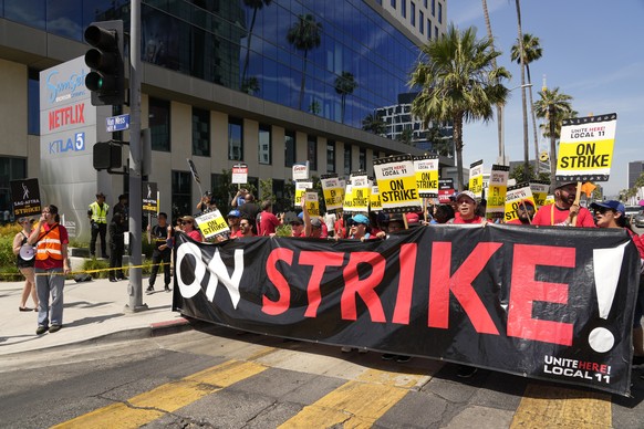 Striking Hotel workers from Unite Here Local 11 join the picketing actors of SAG-AFTRA, and writers of the WGA, outside Netflix studios on July 21, 2023, in Los Angeles. Some Democrats in the Californ ...