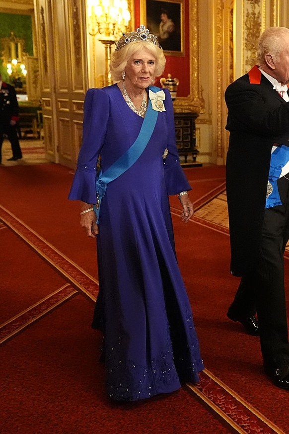 WINDSOR, ENGLAND - SEPTEMBER 17: Queen Camilla arrives for the State Banquet hosted by King Charles III and members of the Royal Family at Windsor Castle during the state visit by the President of the ...
