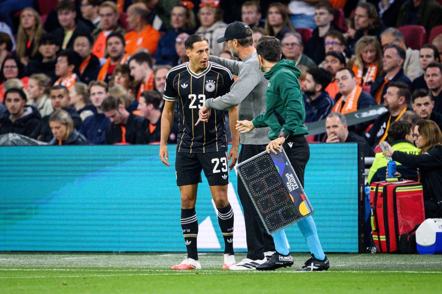 AMSTERDAM, NETHERLANDS - SEPTEMBER 24: Head Coach Juergen Klopp talks to Younes Ebnoutalib of Germany during the UEFA Nations League 2026/27 group phase match between Netherlands and Germany at on Sep ...
