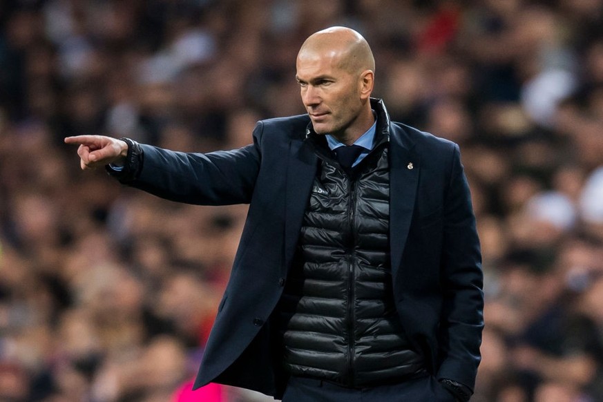 MADRID, SPAIN - FEBRUARY 14: Manager Zinedine Zidane of Real Madrid reacts during the UEFA Champions League 2017-18 Round of 16 (1st leg) match between Real Madrid vs Paris Saint Germain at Estadio Sa ...