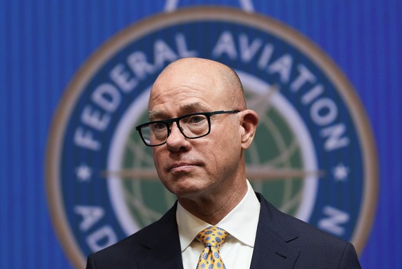 Federal Aviation Administration administrator Bryan Bedford looks on as Transportation Secretary Sean Duffy speaks during a news conference on new drone regulations, Tuesday, Aug. 5, 2025, at the Depa ...