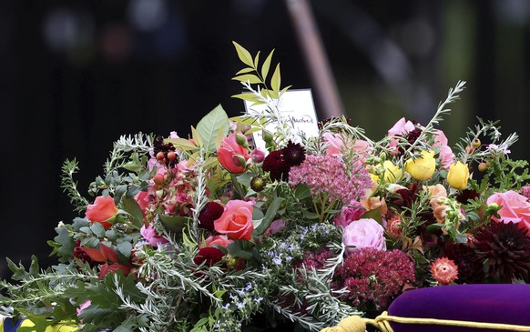 The coffin of Britain&#039;s Queen Elizabeth is carried into the Westminster Abbey in London Monday, Sept. 19, 2022. (Hannah McKay/Pool Photo via AP)