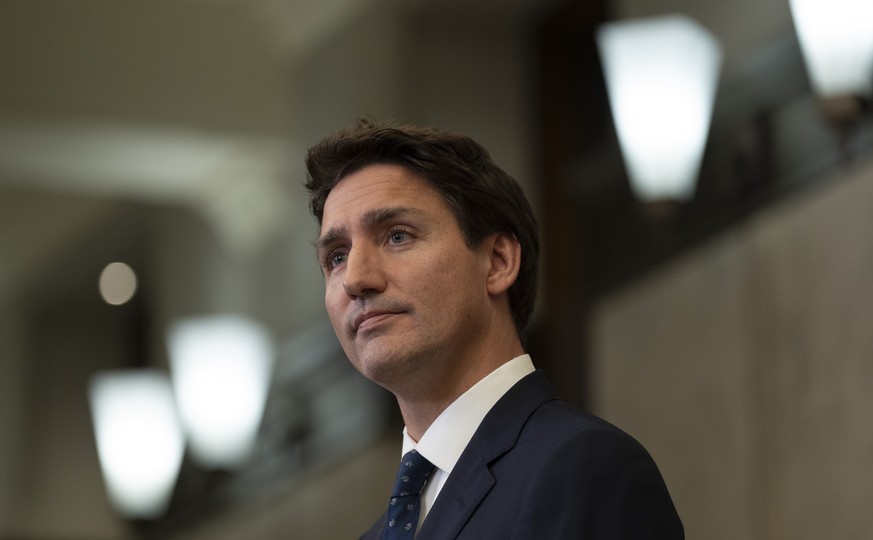 Canadian Prime Minister Justin Trudeau listens to a question after announcing sanctions on Iran, in Ottawa, Friday, Oct. 7, 2022. (Adrian Wyld /The Canadian Press via AP)