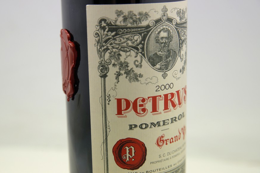 A bottle of Petrus red wine that spent a year orbiting the world in the International Space Station is pictured in Paris Monday, May 3, 2021. The bottle of French wine is up for a private sale at Chri ...