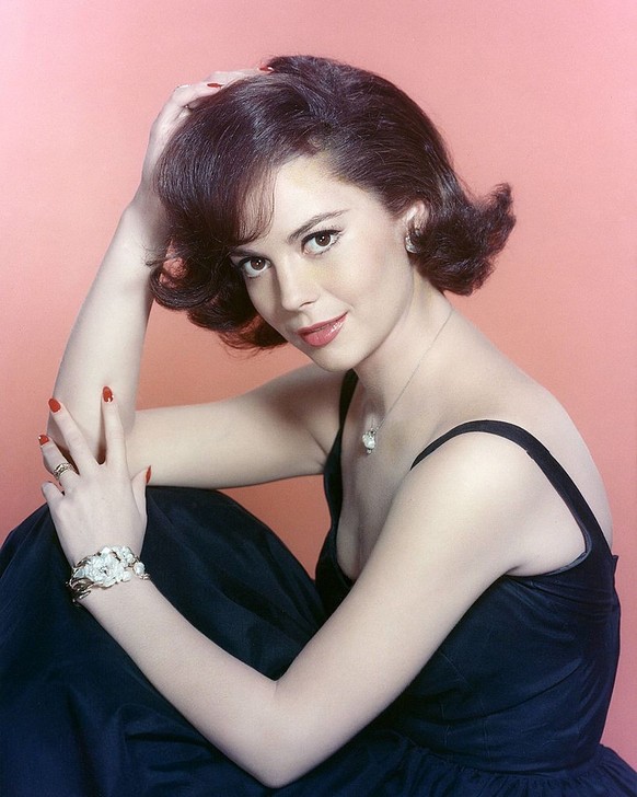 Natalie Wood (1938-1981), US actress, wearing a dark blue dress in a studio portrait, against a pink background, circa 1965. (Photo by Silver Screen Collection/Getty Images)