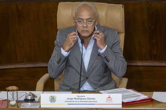 epa13016915 Jorge Rodriguez, president of the National Assembly, reacts during a regular session in which the Bill for the Development and Promotion of Coffee is being debated on its second reading, i ...
