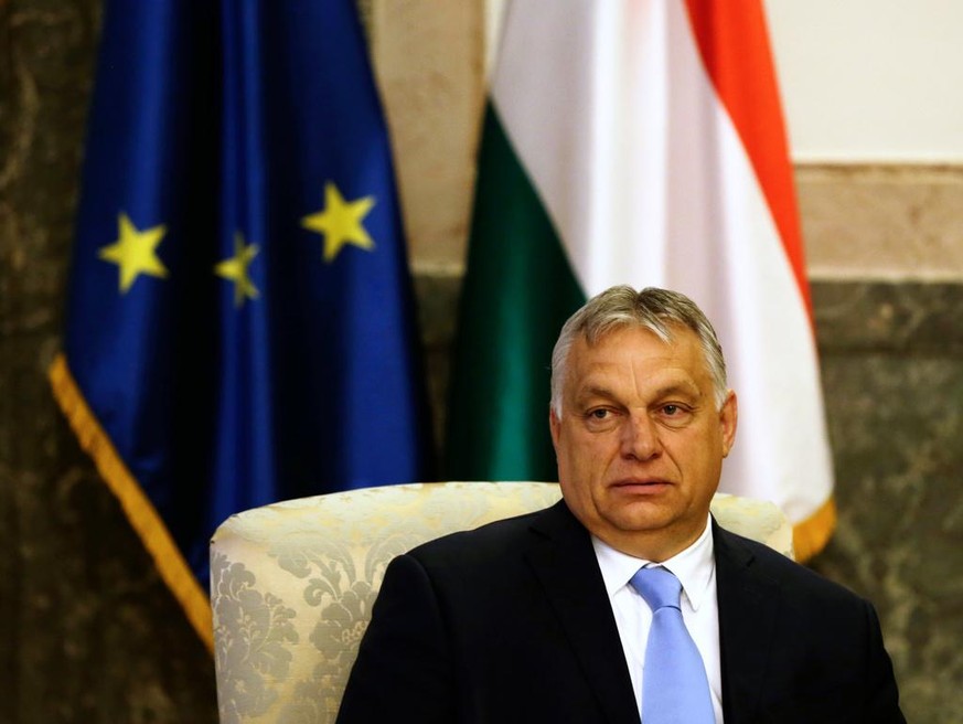 epa09330808 Hungarian Prime Minister Viktor Orban looks at photographers during a meeting with Serbian President Vucic in Belgrade, Serbia, 08 July 2021. Orban is on an official visit to Serbia. EPA/A ...