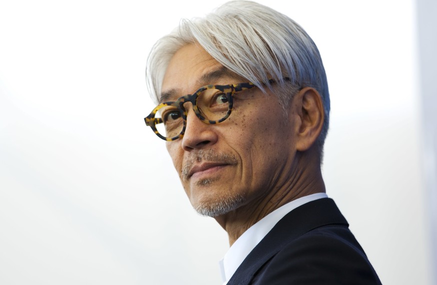 FILE - Maestro Ryuichi Sakamoto poses during a photo call for the film &quot;Coda&quot; at the 74th Venice Film Festival in Venice, Italy, Sept. 3, 2017. Japan&#039;s recording company Avex says Sakam ...