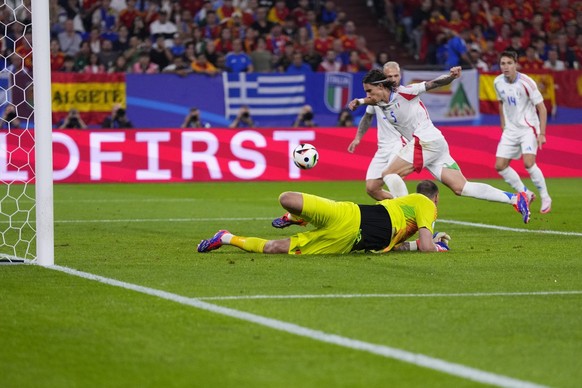 Italy&#039;s Riccardo Calafiori (5) scores an own goal during a Group B match between Spain and Italy at the Euro 2024 soccer tournament in Gelsenkirchen, Germany, Thursday, June 20, 2024. (AP Photo/M ...
