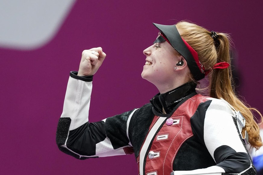 Nina Christen, of Switzerland, reacts after winning the bronze medal in the women&#039;s 10-meter air rifle at the Asaka Shooting Range in the 2020 Summer Olympics, Saturday, July 24, 2021, in Tokyo,  ...