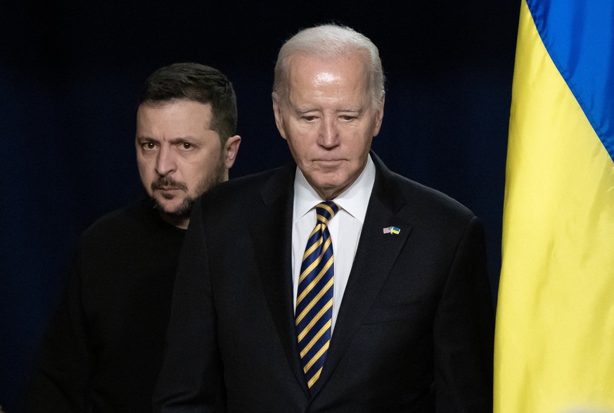 epaselect epa11025624 US President Joe Biden (R) and Ukrainian President Volodymyr Zelensky (L) enter the room to hold a joint news conference in the Indian Treaty Room of the Eisenhower Executive Off ...