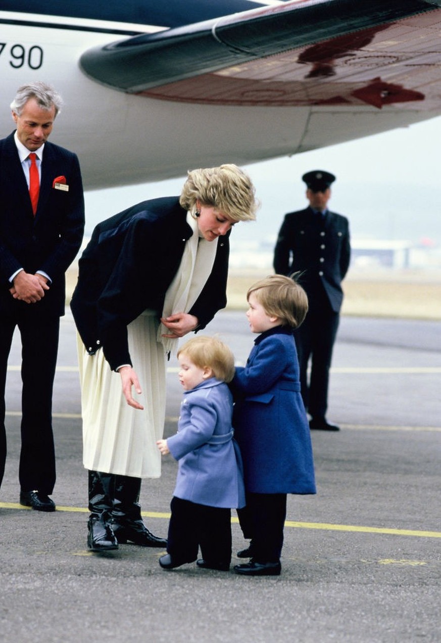 ABEERDEN, UNITED KINGDOM - MARCH 14: Diana, Princess of Wales, arrives with her sons Prince Harry (L) and Prince William (R) at Aberdeen Airport on March 14, 1986 in Aberdeen, Scotland. (Photo by Geor ...