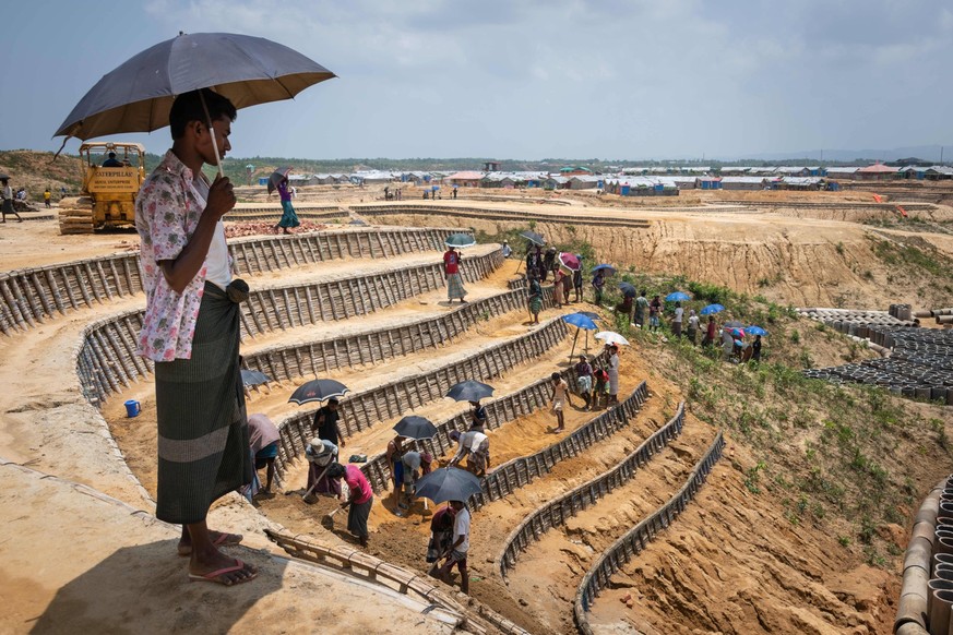 June 1, 2019 - Cox S Bazar, Bangladesh - As monsoon season begins is Cox s Bazar, Bangladesh, thousands of Rohingya refugees are taking part in a paid labor program to build bridges, drainage infrastr ...