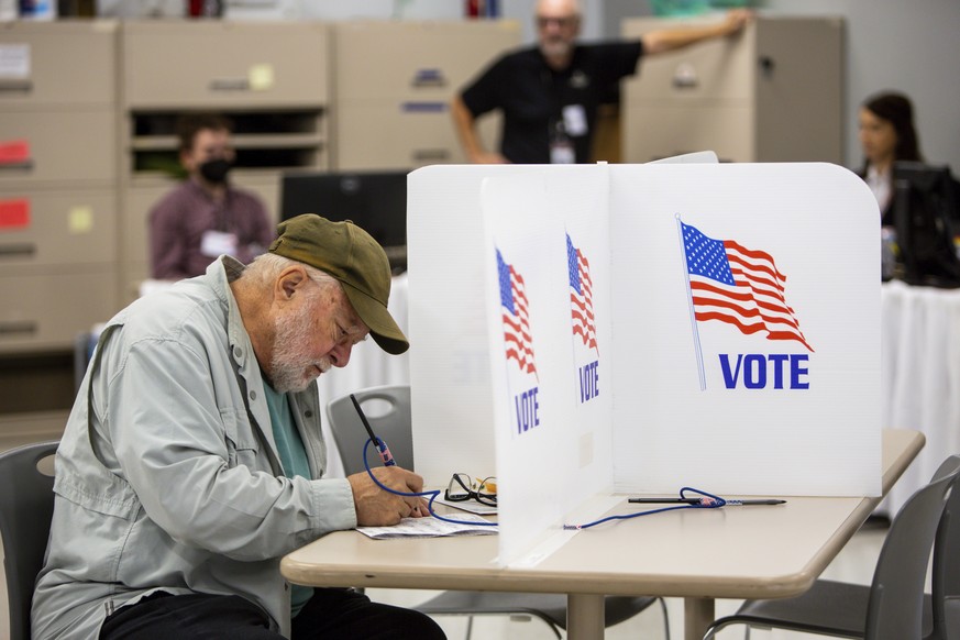 FILE - Voters cast their ballots on Sept. 23, 2022, in Minneapolis. The upcoming midterm elections could give the stock market a sorely needed boost by eliminating at least some of the uncertainty tha ...