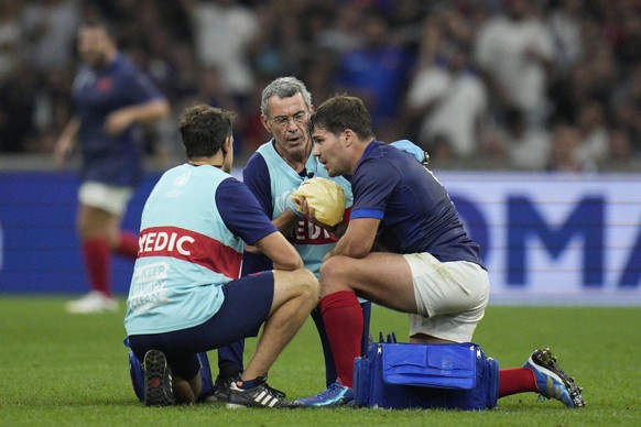 France&#039;s Antoine Dupont receives treatment after taking a knock to the head during the Rugby World Cup Pool A match between France and Namibia at the Stade de Marseille in Marseille, France, Thur ...