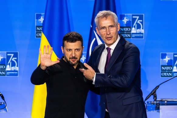 epaselect epa11473085 President of Ukraine Volodymyr Zelensky (L) hugs NATO Secretary General Jens Stoltenberg (R) after the two held a press conference at the 2024 North Atlantic Treaty Organization  ...