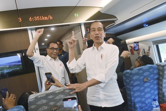 Indonesian President Joko Widodo reacts after speed of 351 km/h inside of high-speed railway during a test ride in Jakarta, Indonesia, Wednesday, Sept. 13, 2023. Indonesia&#039;s President took a test ...