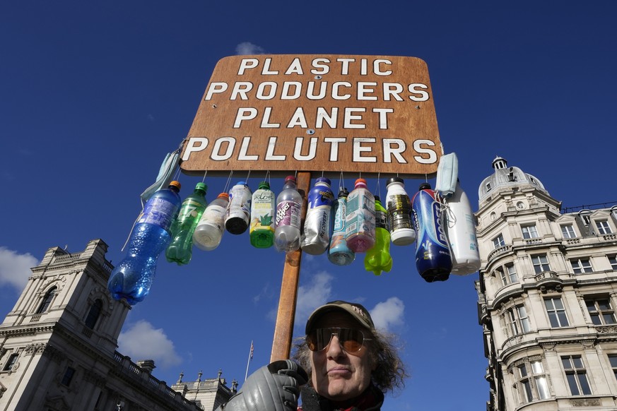 FILE - Anti plastics campaigner Robert Unbranded, who has been regularly clearing plastic waste from parks and streets in his local area of Redbridge, demonstrates in Westminster in London on Nov. 2,  ...