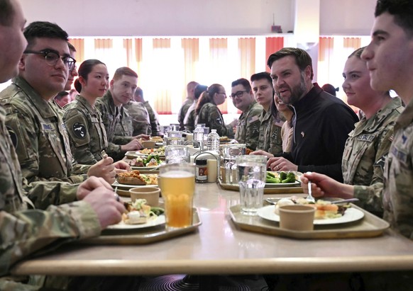 Vice President JD Vance, from third right, and second lady Usha Vance, eat a meal with soldiers at Pituffik Space Base in Greenland, Friday, March 28, 2025. (Jim Watson/Pool via AP)
Vance
