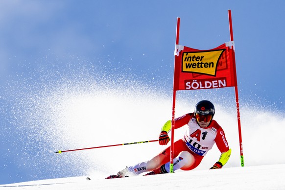 Gino Caviezel of Switzerland in action during the first run of the Men&#039;s Giant Slalom race of the FIS Alpine Skiing World Cup season opener on the Rettenbach glacier, in Soelden, Austria, Sunday, ...