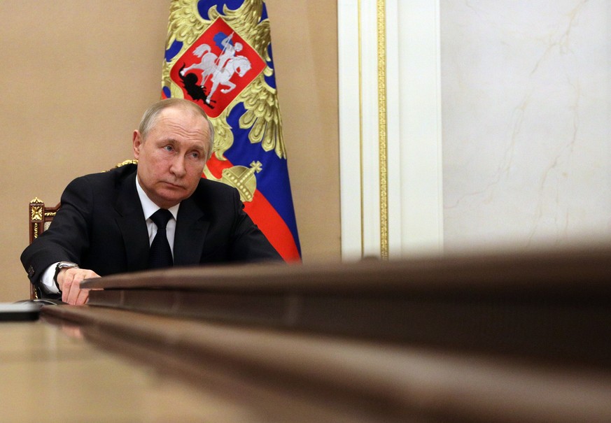 epa09815011 Russian President Vladimir Putin attends a videoconference meeting with Government members at the Kremlin in Moscow, Russia, 10 March 2022. The meeting focuses on minimising the impact of  ...