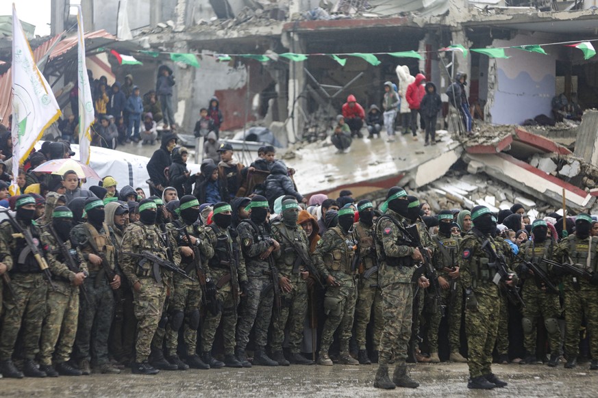 Hamas fighters are deployed in Rafah ahead of the planned release of two among six Israeli hostages set to be handed over to the Red Cross, Gaza Strip, on Saturday, Feb. 22, 2025. (AP Photo/Jehad Alsh ...