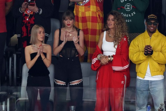 LAS VEGAS, NEVADA - FEBRUARY 11: Singer Taylor Swift and Actress Blake Lively react prior to Super Bowl LVIII between the San Francisco 49ers and Kansas City Chiefs at Allegiant Stadium on February 11 ...