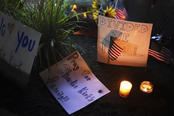 Signs are seen at a growing vigil for Charlie Kirk outside Timpanogos Regional Hospital after Kirk was shot and killed Wednesday, Sept. 10, 2025, in Orem, Utah. (AP Photo/Lindsey Wasson)
Charlie Kirk  ...