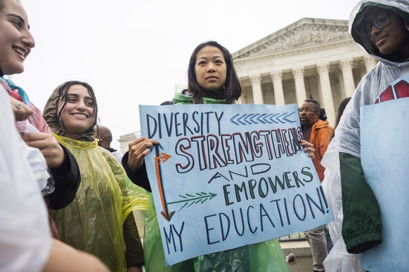 epa10277161 Supporters of affirmative action gather outside the US Supreme Court as the judges prepare to hear oral arguments in two cases challenging the use of race in college admissions in Washingt ...
